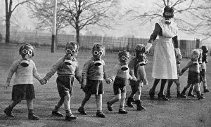 Evacuee children in gas masks near Windsor, 1941