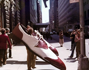 Oversize Gallery: Exhibition image of men wearing large shoes