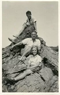 Outcrop Gallery: Family group photograph at the seaside - posing on a rock