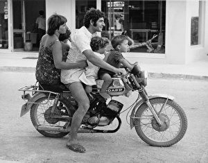 Family of five on a motorcycle in Rhodes, Greece Family of five on a motorcycle in Rhodes, Greece