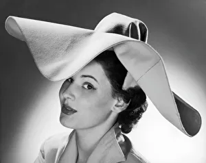 <b class=qtipBold><figcaption>Fashionable 1950S Hat</figcaption></b><br>A woman wears a felt hat with a large, floppy brim.<br><em>© Mary Evans Picture Library</em> Fashionable 1950S Hat