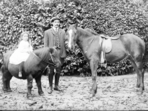 Father and daughter with horse and pony, Mid Wales Father and daughter with horse and pony, Mid Wales