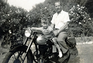 Father & son on a 1950s BSA motorcycle Father & son on a 1950s BSA motorcycle