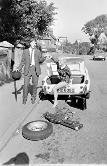 Briefcase Gallery: Female contortionist Diana Gaye and car boot