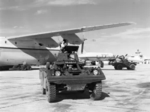 Aeroplanes Collection: A Ferret armoured scout car at Belize with a RAF Short SC-5
