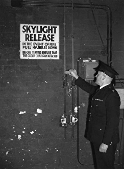Fire prevention officer checking skylight release Fire prevention officer checking skylight release