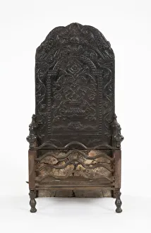 <b class=qtipBold><figcaption>Fireback and grate</figcaption></b><br>Cast iron fireback with a grate component and an arched top, decorated with a vase, roses and other floral motifs within a trailing foliate border surmounted by sea-monsters, possibly Flemish, c.1700-1750. Date: 1700-1750<br><em>© The Geffrye Museum of the Home / Mary Evans Picture Library</em> Fireback and grate