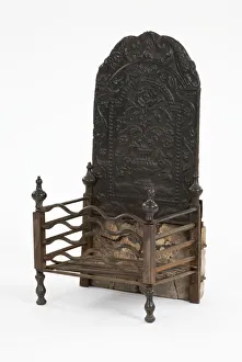 <b class=qtipBold><figcaption>Fireback and grate</figcaption></b><br>Cast iron fireback with a grate component and an arched top, decorated with a vase, roses and other floral motifs within a trailing foliate border surmounted by sea-monsters, possibly Flemish, c.1700-1750. Date: 1700-1750<br><em>© The Geffrye Museum of the Home / Mary Evans Picture Library</em> Fireback and grate