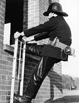 Hook Collection: Firefighter during hook ladder practice