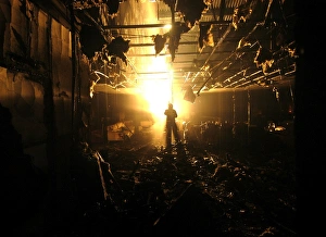 Firefighter at the scene of a fire in a furniture shop Firefighter at the scene of a fire in a furniture shop