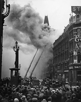Firefighters in action at Ludgate Circus, London Firefighters in action at Ludgate Circus, London
