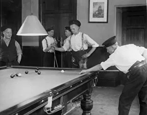 Images Dated 1st August 2015: Firefighters playing billiards in fire station