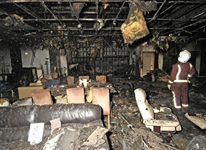 Firefighters at the scene of a fire in a furniture shop Firefighters at the scene of a fire in a furniture shop