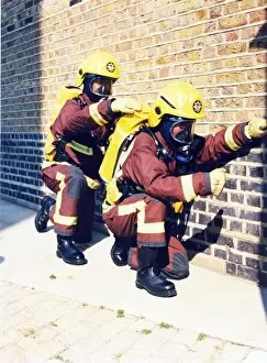 Images Dated 31st May 1998: Firefighters in training with breathing apparatus