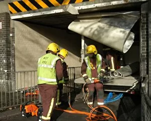 Accidents and Crashes Gallery: Firefighters working to remove van trapped under bridge