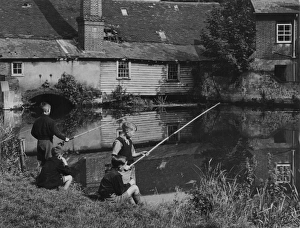 <b class=qtipBold><figcaption>Fishing by the Mill</figcaption></b><br>The Middle Mill, formerly called The King's Mill, on the River Colne, Colchester, Essex, England, now sadly demolished forever.<br><em>© Mary Evans Picture Library</em> Fishing by the Mill