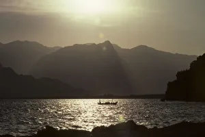 Fishing boat with a backdrop of Taurus mountains, Antalya Fishing boat with a backdrop of Taurus mountains, Antalya