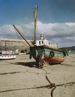 Prints of Fishing boat, Our Pride, on St Ives beach, Cornwall, with fisherman. Date: circa 1970s England Prints: Fishing Boat Print, St Ives Beach, Cornwall circa 1970s