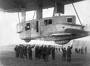 <b class=qtipBold><figcaption>The forward gondola of the R34</figcaption></b><br>The forward gondola of the R34. The airship is being eased up, preparatory to flight, when the lines held by the groundcrew will be released from the handling rail. 14 March 1919 (the first flight). Date: 1919<br><em>© The Royal Aeronautical Society (National Aerospace Library) / Mary Evans Picture Library</em> The forward gondola of the R34