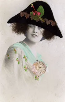 <b class=qtipBold><figcaption>French Fashion - Large back felt hat</figcaption></b><br>French Fashion - Large back felt hat worn by a photographic model, although the hat is rendered in felt and fabric and the girl's hair is from some un-determined source...! Moderate satire on the penchant for women to wear large and enveloping hats during this period. Date: circa 1910s<br><em>© Mary Evans / Grenville Collins Postcard Collection</em> French Fashion - Large back felt hat