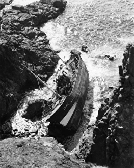 French fishing boat on rocks, Dollar Cove, Cornwall French fishing boat on rocks, Dollar Cove, Cornwall