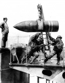 French soldiers hoisting an artillery shell French soldiers hoisting an artillery shell