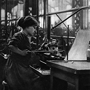 Striker Gallery: French woman in a munitions factory, making parts for arti