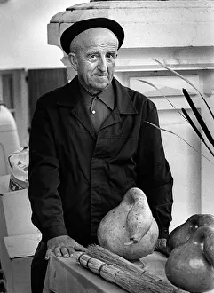 1991 Gallery: Frenchman with large gourd in a market in Montaigu-de-Quercy