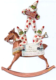 Three frogs and rocking horse on a cutout card Three frogs and rocking horse on a cutout card