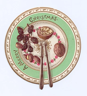Fruit and nuts on a plate on a cutout Christmas card Fruit and nuts on a plate on a cutout Christmas card