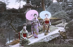 Position Gallery: Garden Scene, Japan - Geisha - Posed on a small stone bridge