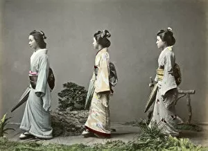 Geishas with parasols and obi sashes, Japan