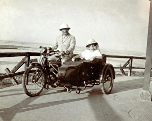 Gentleman & lady on their 1910 Triumph motorcycle & sidecar Gentleman & lady on their 1910 Triumph motorcycle & sidecar