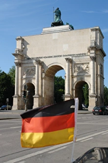 German flag and Siegestor, Munich, Germany German flag and Siegestor, Munich, Germany