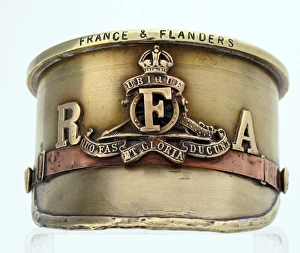 German Howitzer shell case - an Army Service cap German Howitzer shell case - an Army Service cap