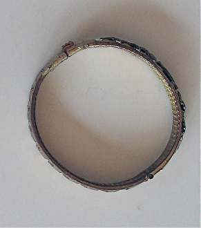 Gilded copper drive band fashioned as a patriotic bracelet Gilded copper drive band fashioned as a patriotic bracelet