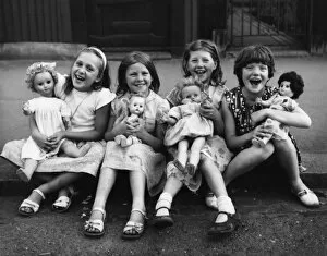 Girls with their dolls in a Balham street, SW London