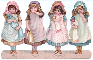 Four girls with dolls on a cutout Christmas card Four girls with dolls on a cutout Christmas card