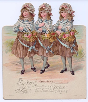 Three girls with flowers on a cutout Christmas card Three girls with flowers on a cutout Christmas card