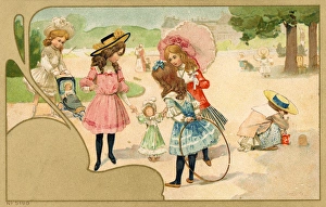 Girls having fun in the park playing with hoops and dolls Girls having fun in the park playing with hoops and dolls