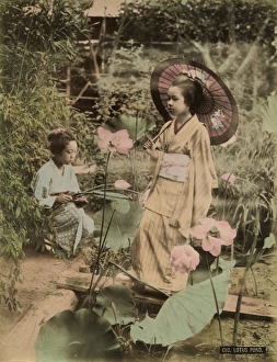 <b class=qtipBold><figcaption>Girls at lotus pond</figcaption></b><br>Two young Japanese girls, one holding a parasol, with lotus flowers<br><em>© Mary Evans/Pump Park Vintage Photography</em> Girls at lotus pond