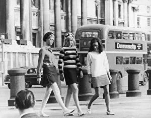 <b class=qtipBold><figcaption>Three Girls in Minis</figcaption></b><br>Take Three Girls Three young women wearing mini skirts in Trafalgar Square, London. A "No 11" bus going to Liverpool Street station passes by in the background.<br><em>© Mary Evans Picture Library</em> Three Girls in Minis