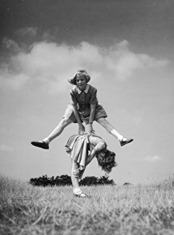 <b class=qtipBold><figcaption>Two Girls Play Leapfrog</figcaption></b><br>Two girls playing leapfrog in country grassland<br><em>© Mary Evans Picture Library</em> Two Girls Play Leapfrog