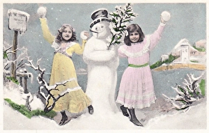 Two girls with snowman on a Christmas postcard Two girls with snowman on a Christmas postcard