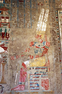 The god Amon, sitting at a table of offerings. Temple of Hat The god Amon, sitting at a table of offerings. Temple of Hat