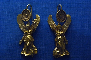 Golden earrings with shaped like a Nike Golden earrings with shaped like a Nike