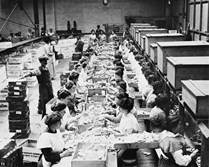 <b class=qtipBold><figcaption>Grocery rations, World War I</figcaption></b><br>Women making up grocery rations for soldiers during World War I<br><em>© Mary Evans/Robert Hunt Collection/Imperial War Museum</em> Grocery rations, World War I