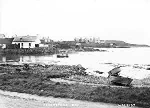 Prints of Groomsport Bay - a view across the Bay with beached rowing boats in the foreground to buildings in the distance. (Location: Northern Ireland; County Down; Groomsport). Date: circa early 1900s Down Prints: Groomsport Bay Print: Early 20th Century Scene