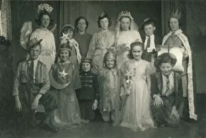 Group of children in fancy dress, in costumes ranging from an angel