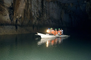 A group of tourists on a boat with a guide - inside A group of tourists on a boat with a guide - inside